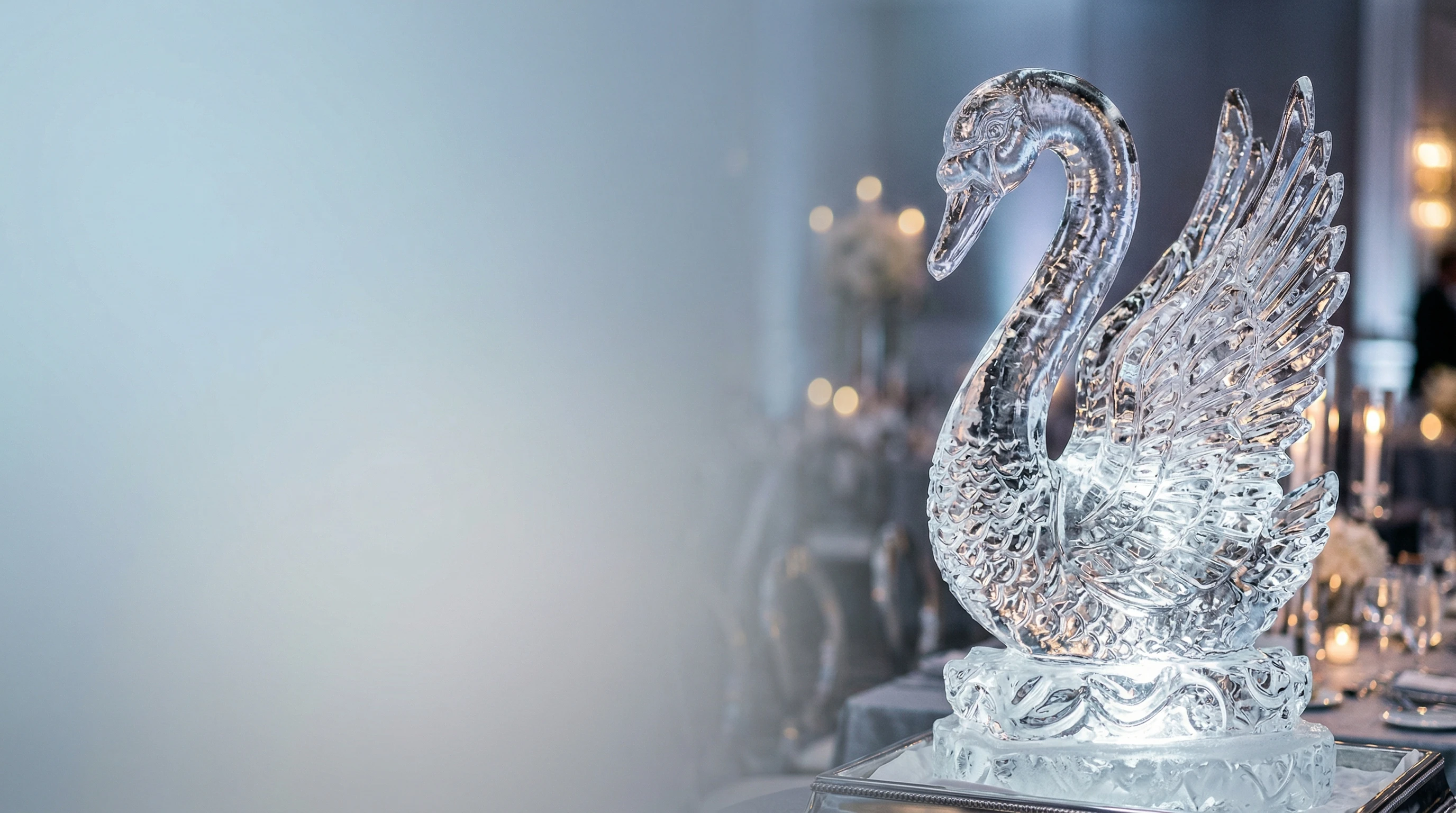 Three-dimensional ice sculpture centerpiece at an elegant event venue
