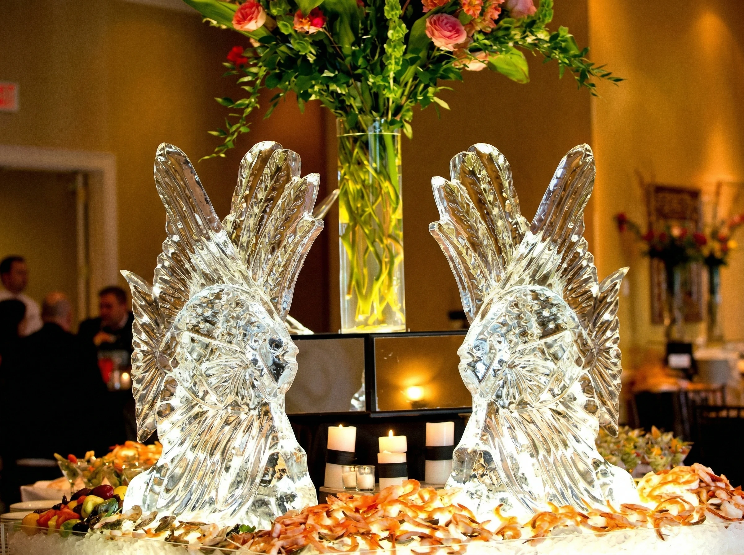 Ice artist hand-carving fine details during a live event performance